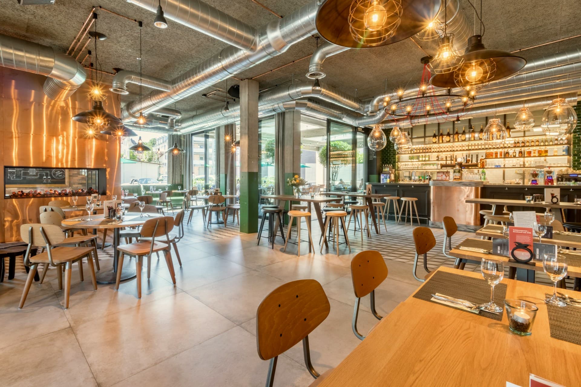 Restaurant interior with bar seating and pendant lighting